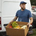 Courier delivering fresh vegetables